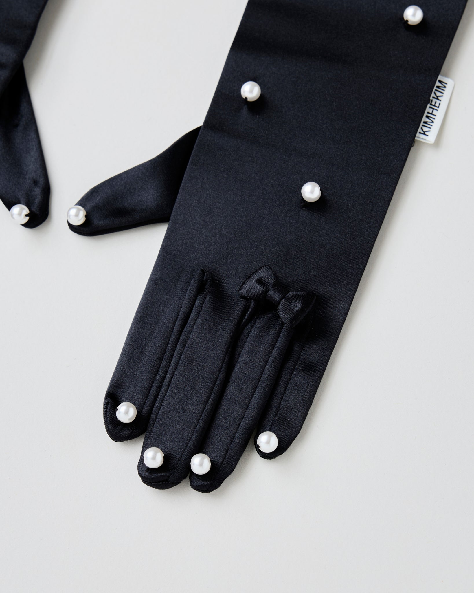 Pearl embellished satin gloves