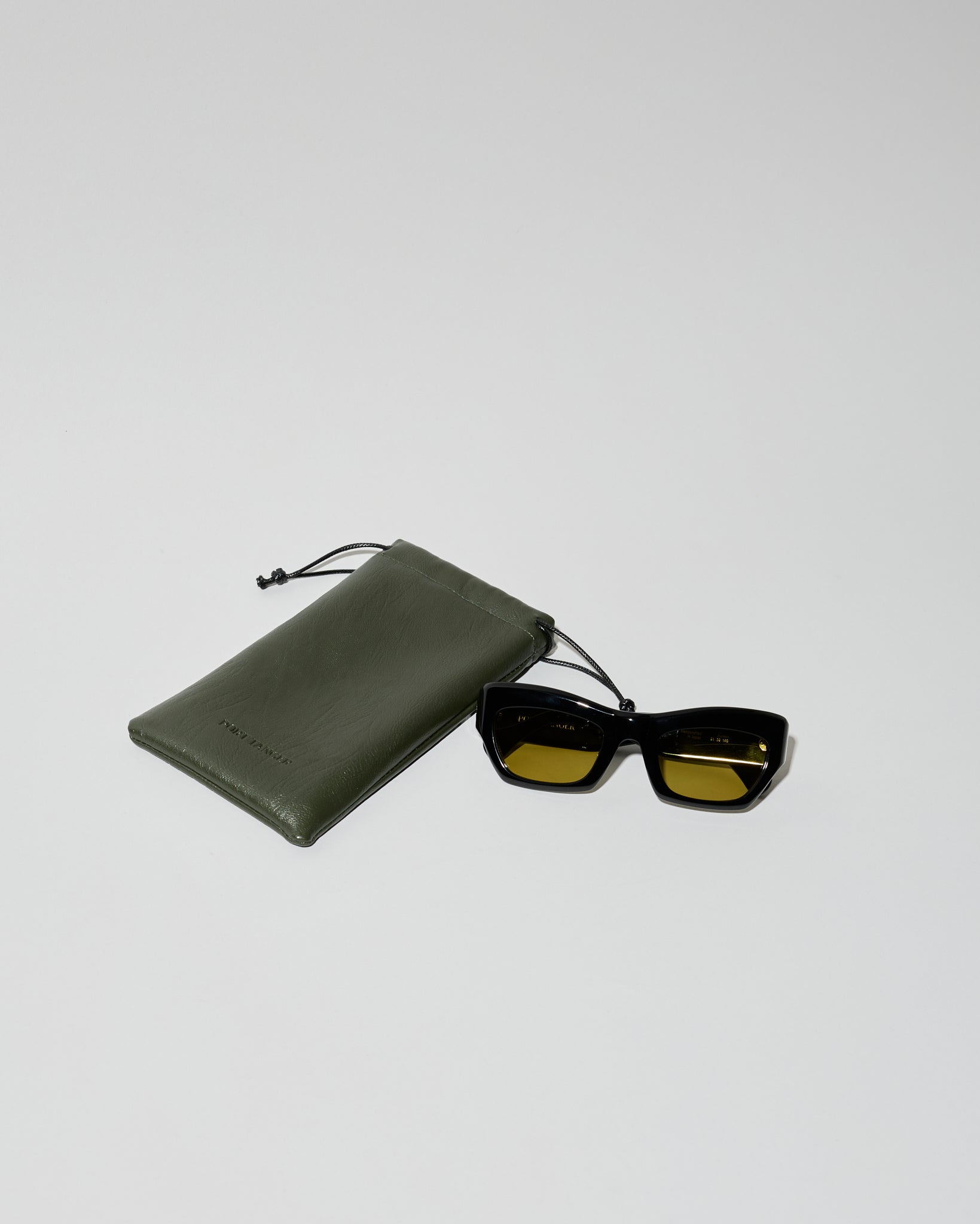 Ayreen in black acetate with warm olive lens